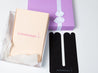 black tummytape pregnancy tape beside purple gift box